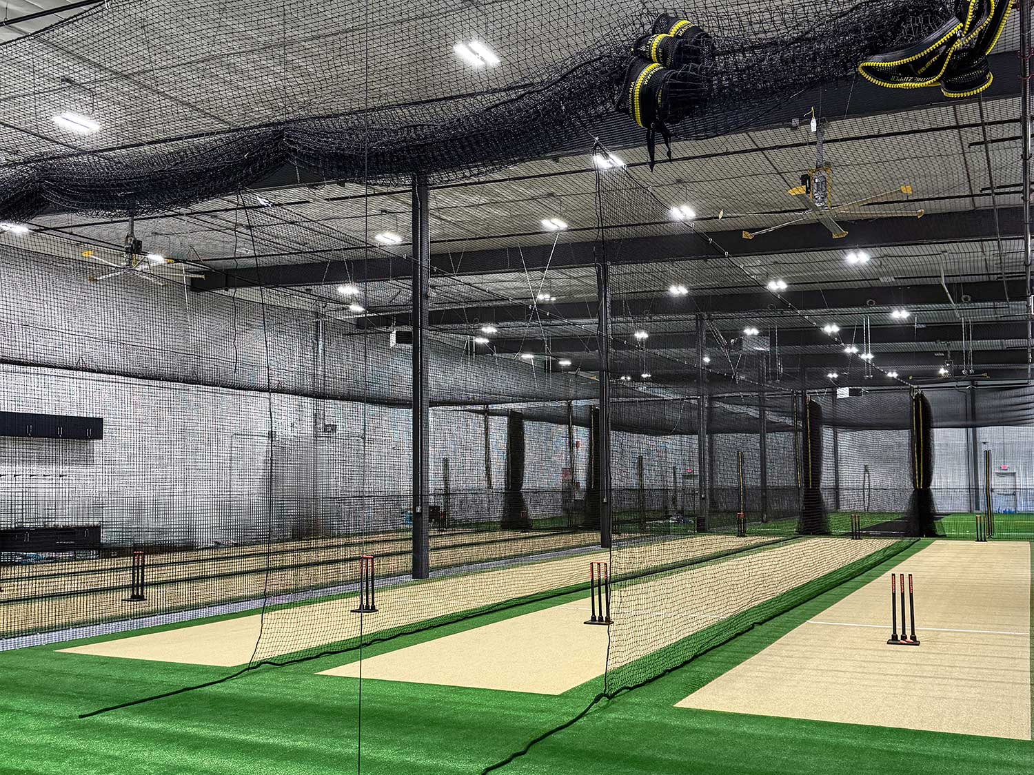 Finished practice lanes with retractable netting at United Sports Arena